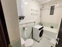 Стиральная машина в ванной комнате