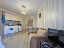 комфортне зонування на вітальню, кухню та спальню